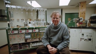 photo of Wally Broecker sitting in a lab