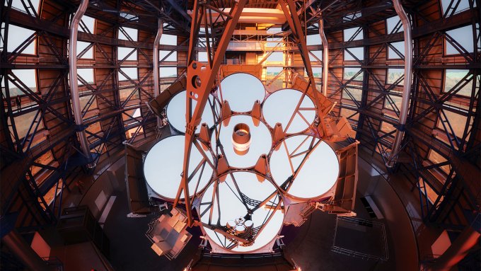 An image of the Giant Magellan Telescope and its seven huge primary mirrors.