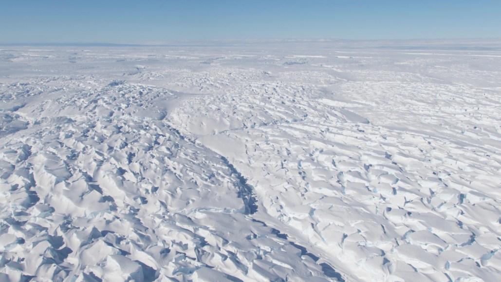 A photo of the vast and rugged surface of Thwaites Glacier, from above.